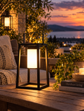 Portable solar outdoor lantern glowing on a patio at dusk