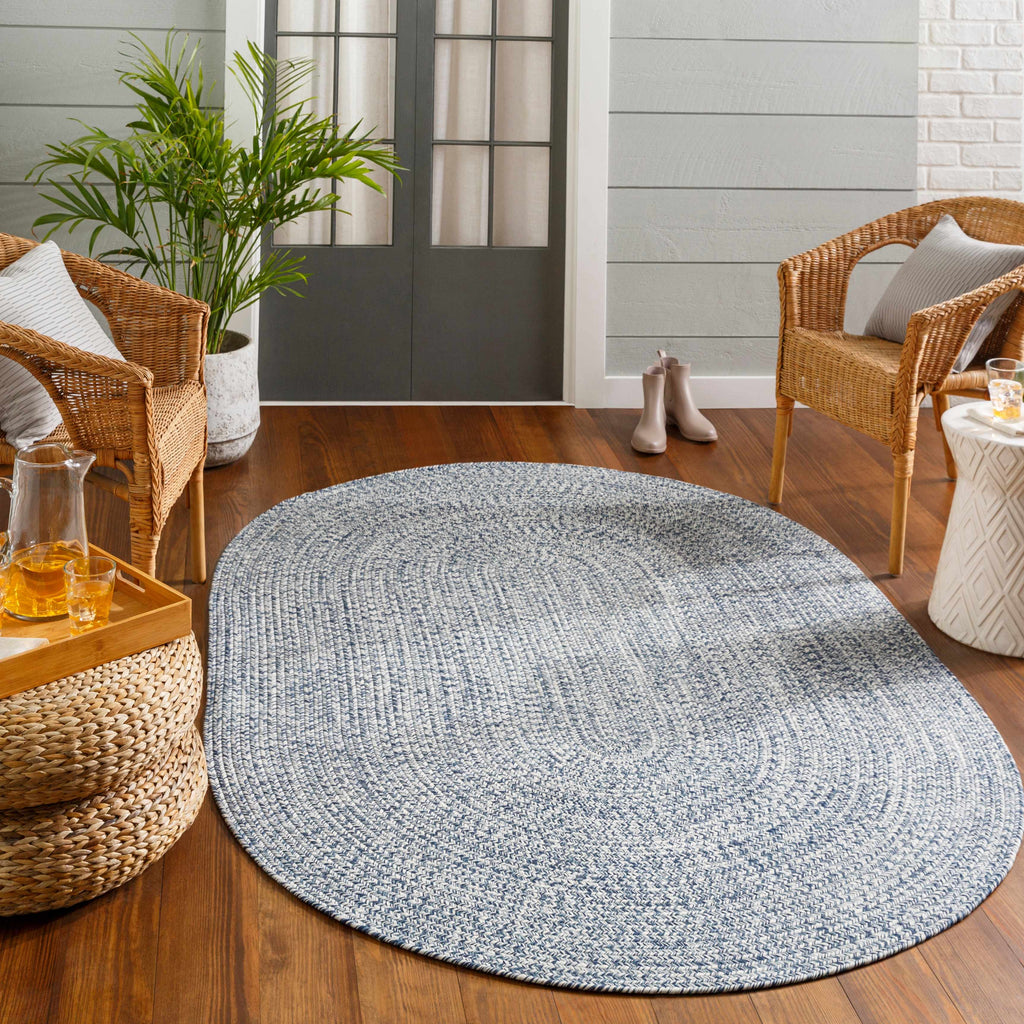 Carbrook blue braided outdoor rug styled in a living space