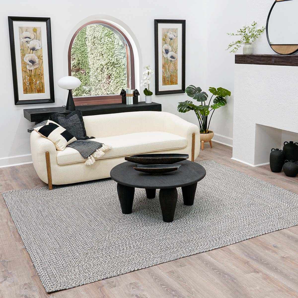 Cranwell cream charcoal outdoor rug in a furnished room