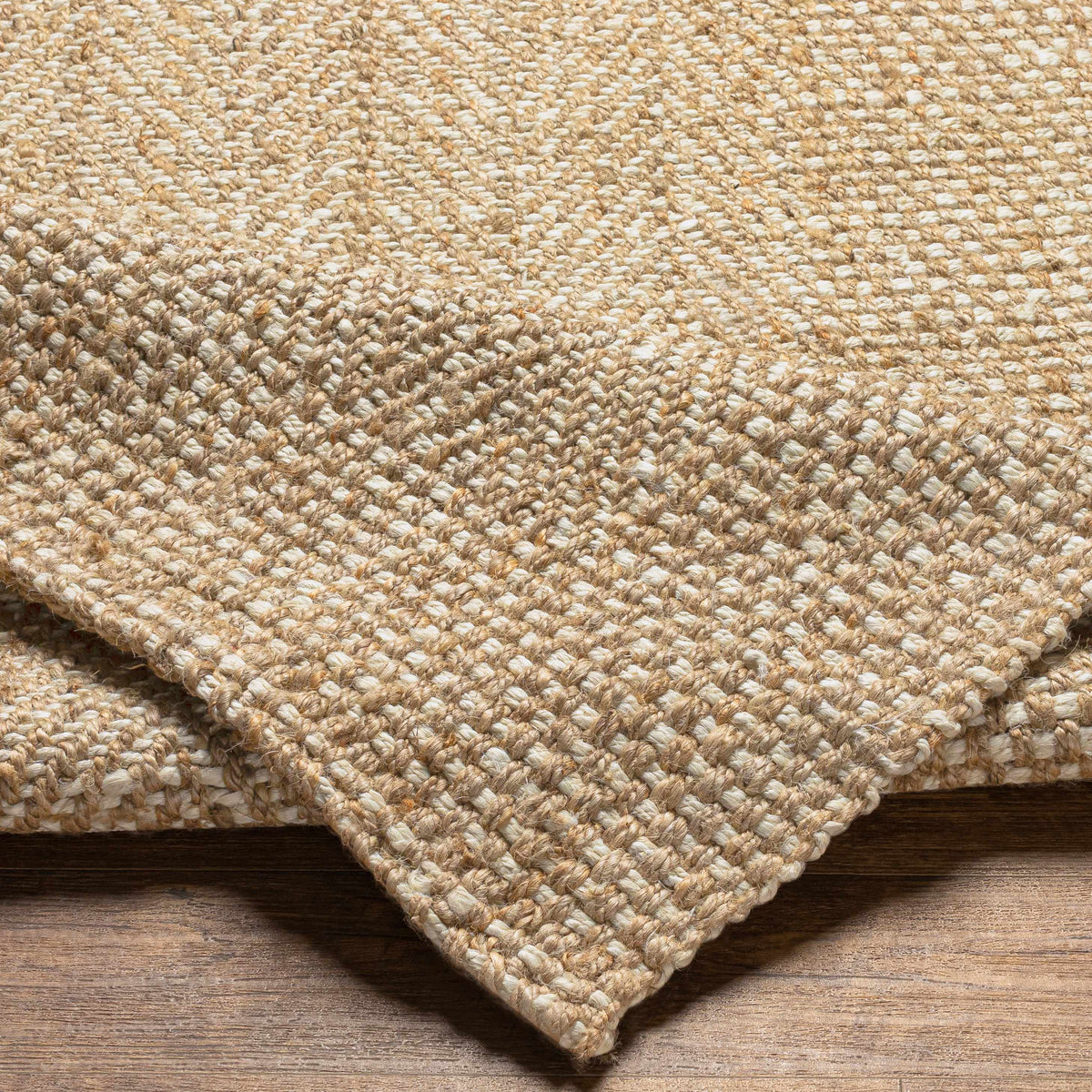 Folded Dinah natural jute rug showing woven texture