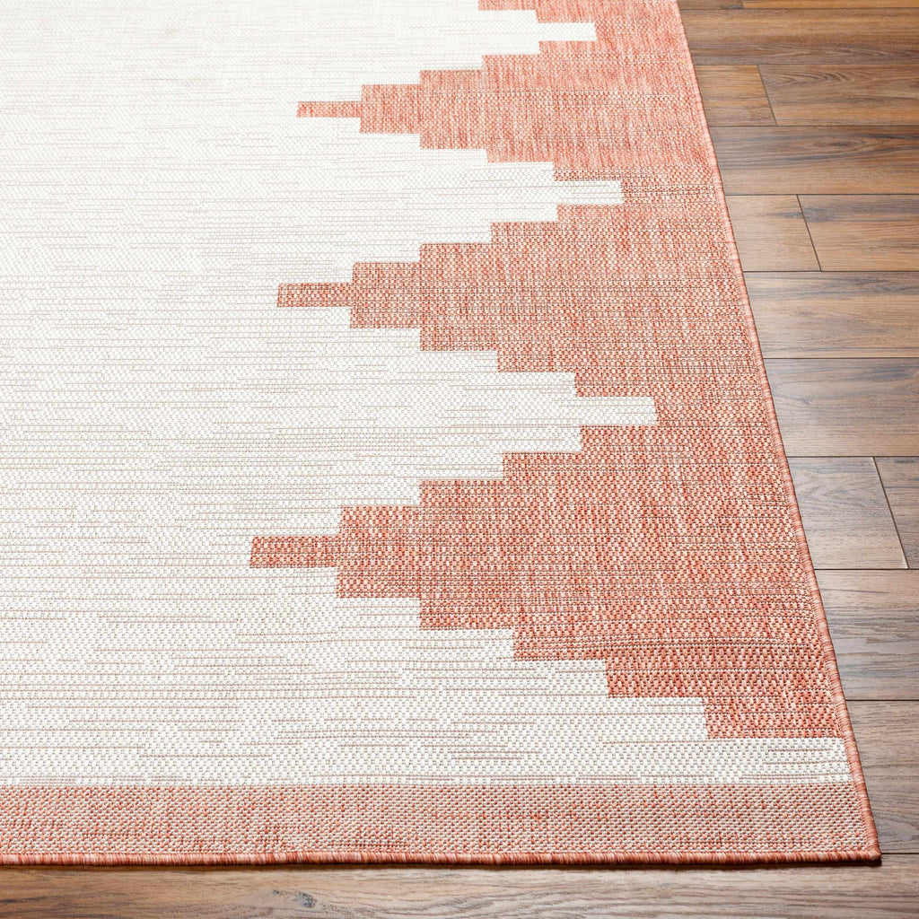 Peach geometric polypropylene outdoor rug front view